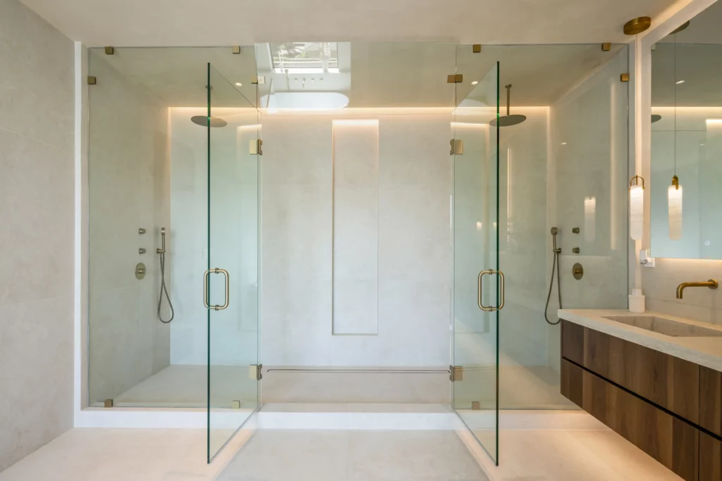 Modern bathroom with dual glass-enclosed showers