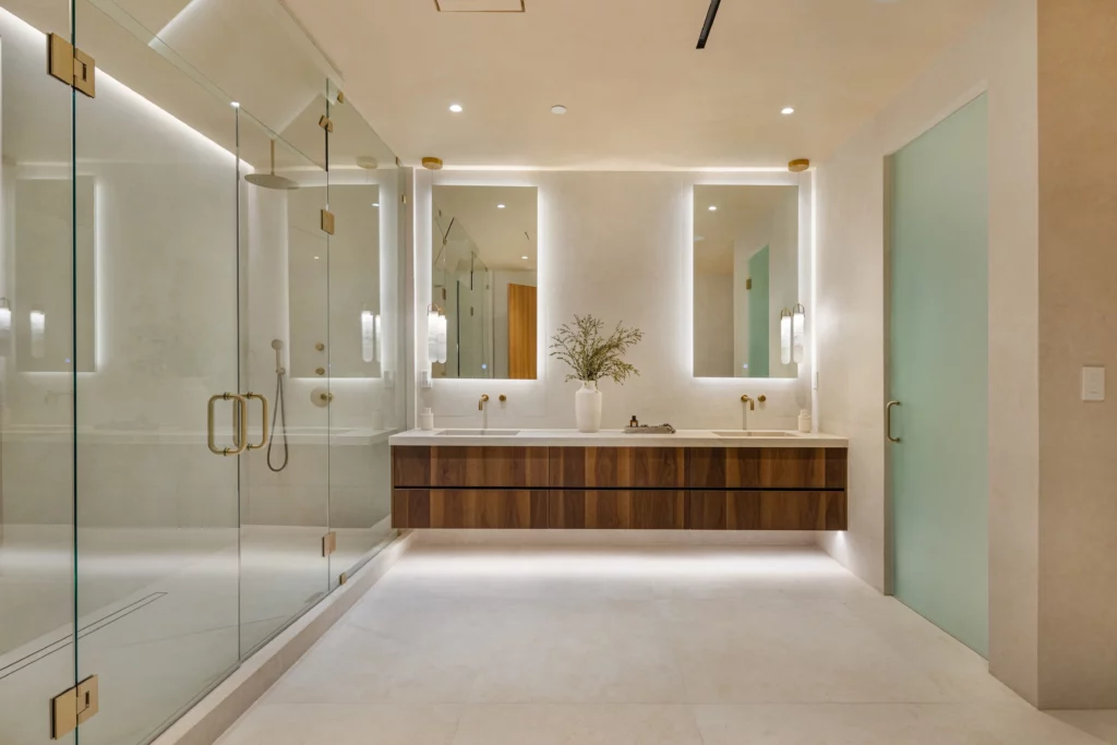 Modern bathroom with glass shower and wooden vanity